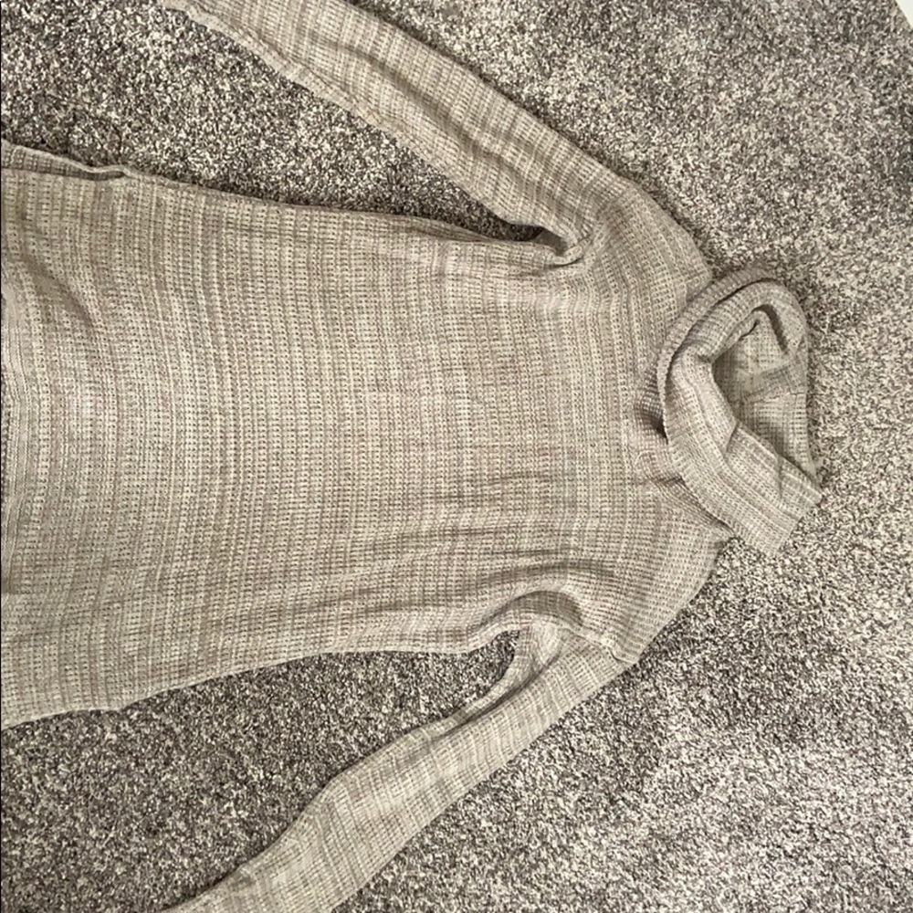 Neutral color sweater.
